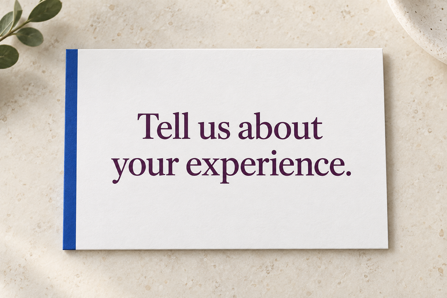 Illustrative review card on a counter reading Tell us about your experience.